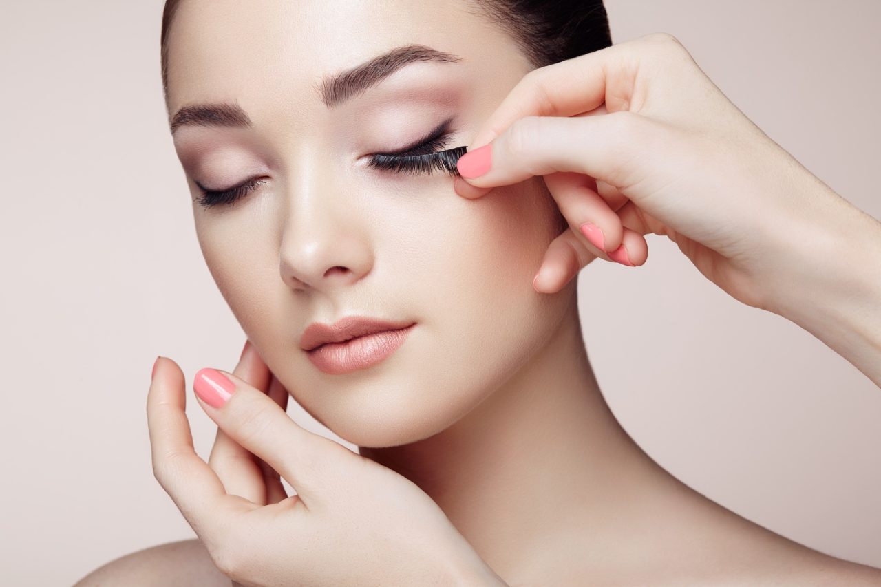 Makeup Artist Glues Eyelashes.jpg